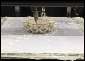 3D clay printer nozzle printing a ceramic piece